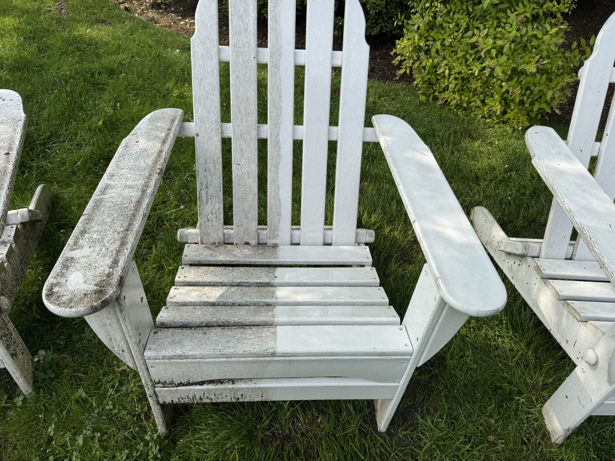Half-washed Adirondack chair showing dramatic before and after